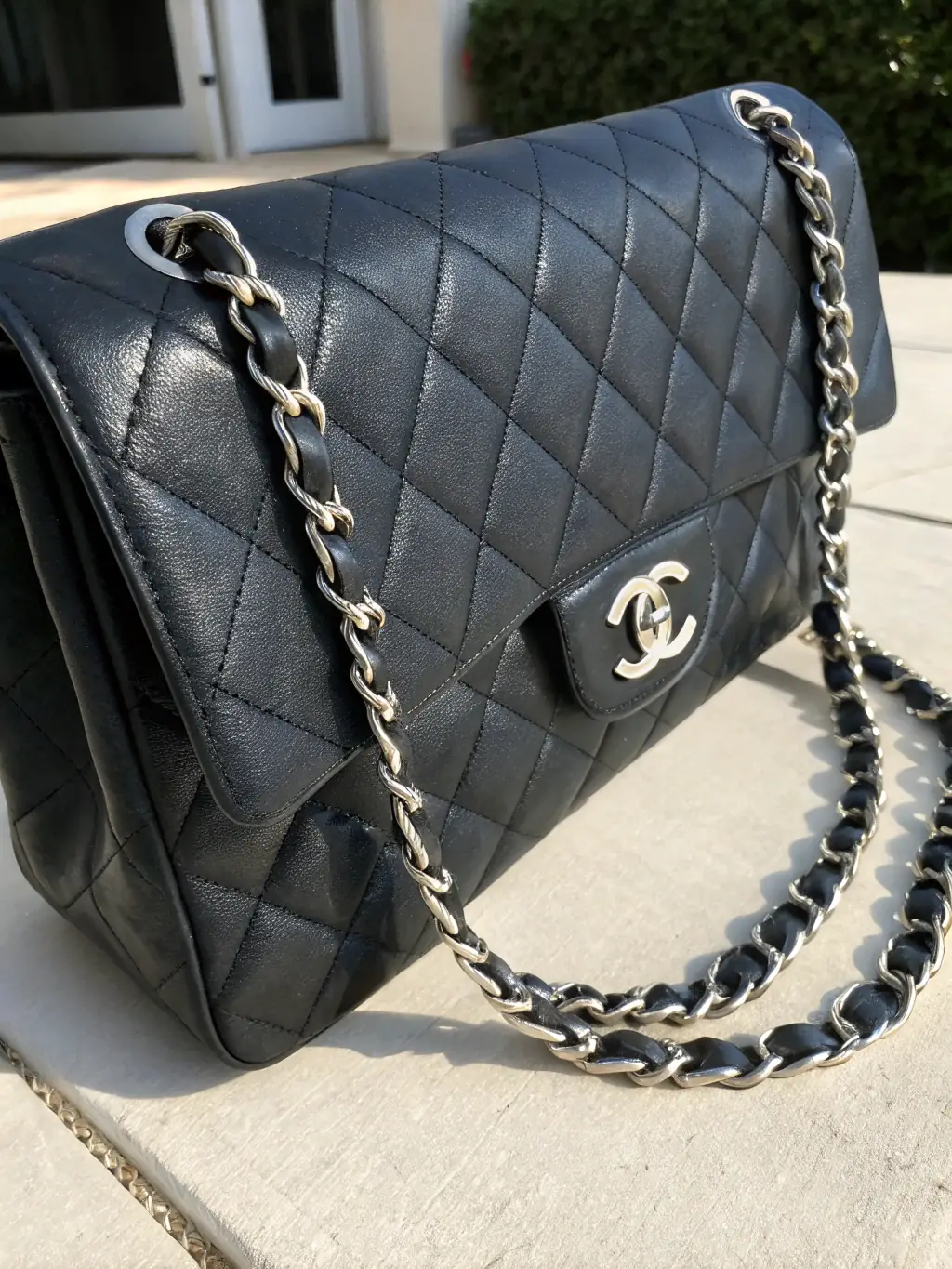 A photograph of a vintage Chanel Classic Flap bag, highlighting its timeless design and historical significance, emphasizing the ability to source vintage and collectible items.